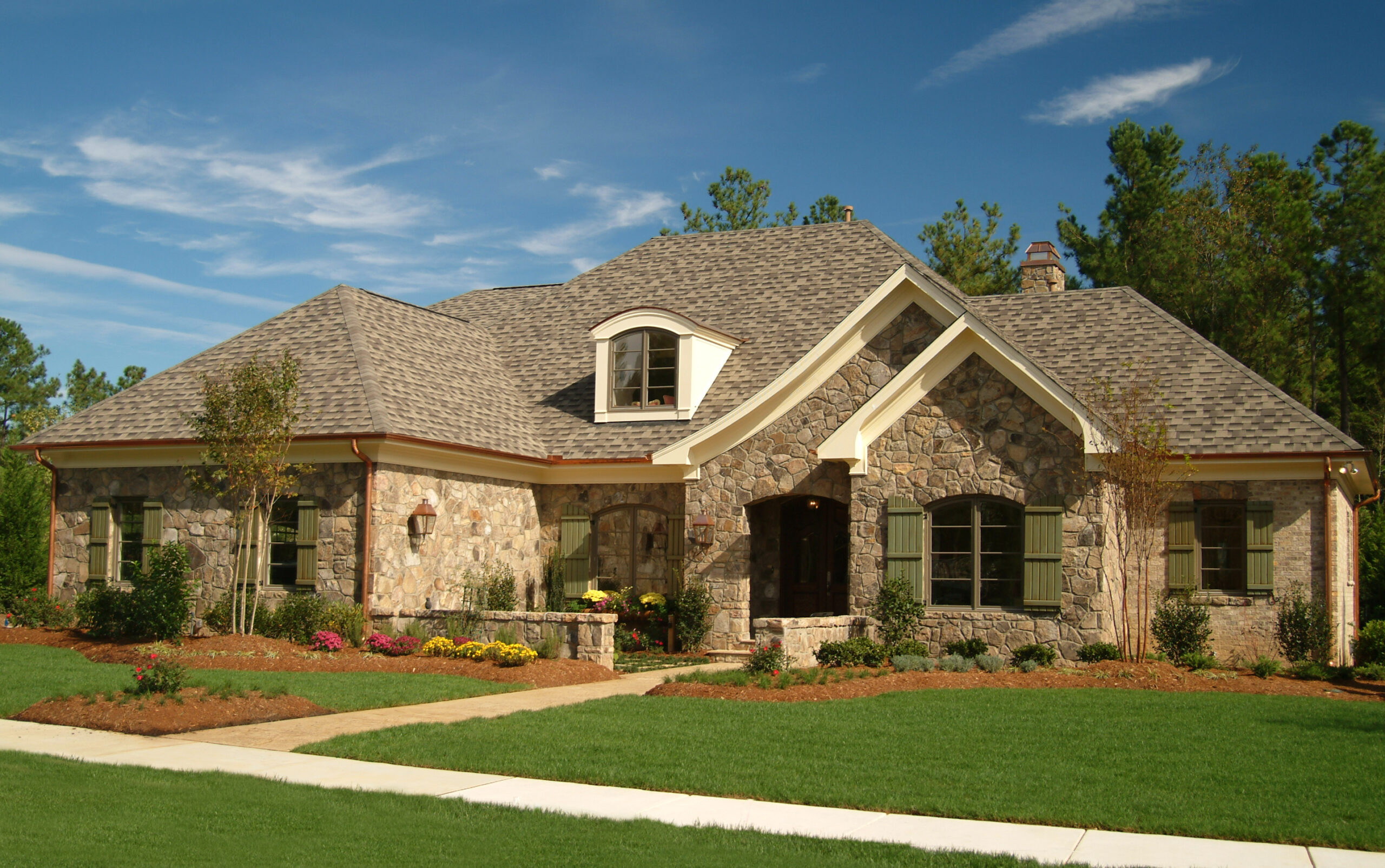 A beautiful home in Browning, TX features a stone exterior.